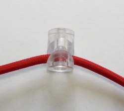 Plastový úchyt kabelu průměr 19,5mm x 27mm transparentní